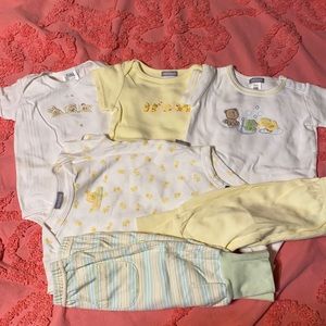 Lot of baby onesies and matching pants